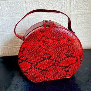 Beautiful red faux snake skin round purse